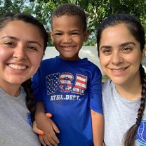 My friend and I with one of the kiddos at camp