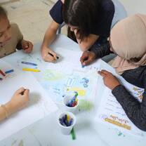 Volunteers in Jordan with IVHQ painting