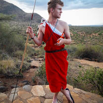 Man dressing as Maasai at Il Ngwesi in Kenya with Culsans