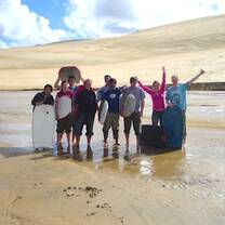 Stepabroad participant sandboarding in Cape Reinga, North Island