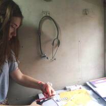 Medical volunteer in India preparing medicine.