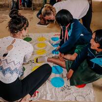 Enjoying some down time with the local school children with a game of Twister.