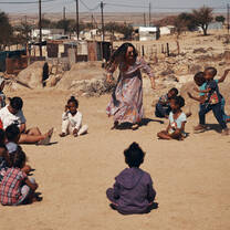 Teaching, playing with the kids at the local school