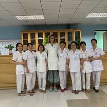 Posing with hospital staff