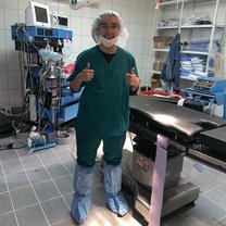 Here I am in my scrubs after finishing a surgery