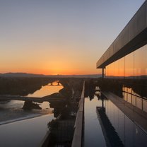 Sunset over the Arno River in Florence from a rooftop bar