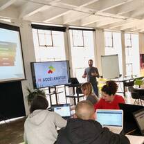 Another shot of the class room where a different instructor is speaking