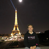 Picture in front of the Eiffel Tower while travelling to Paris
