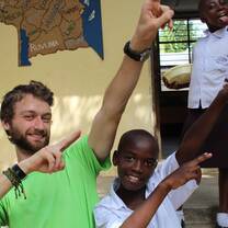 help2kids volunteer posing with kids