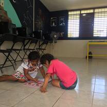 Village Book Builders excursion to Mayan Temple, local village kids and community members using the library.