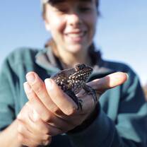 Me holding a frog during our research project in the Cape