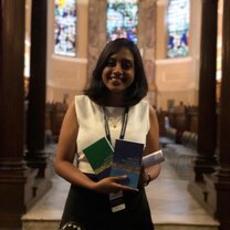 A picture of myself after our Graduation Ceremony with the books I won as my Attainment Awards for Philosophy and Contemporary History for topping the class.