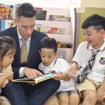 TEFL participants reading to children in Suzhou with Kids-English Thailand.