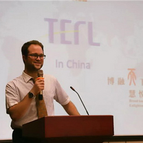 TEFL Instructor Cory presenting to Kids-English Thailand in China.