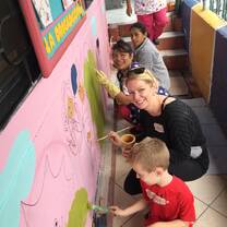 Painting murals at child center in Ecuador