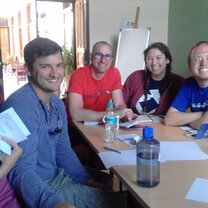 Students in a small group learning to communicate in Spanish A small group Spanish class in Quito