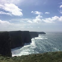 Cliffs of Moher on a Rare Clear Day This is a picture of the stunning Cliffs of Moher on the west coast of Ireland. They are absolutely marvelous and if I could have set up a tent right there so I could stare at them every day, I would have.
