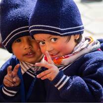 Blushing children preparing for a photo