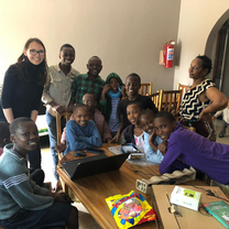 Volunteer donates a laptop to the orphanage