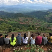 A group photo with the hills and fields of the Lisu Village in the background. Such a beautiful view that I will never forget. 