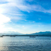 A sunrise over Lombok with many shades of blue 