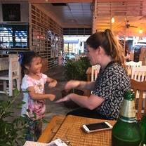 playing with a new friend at a restaurant