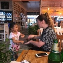 playing with a new friend at a restaurant