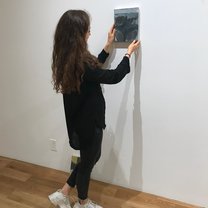 Hanging an artwork in the Gallery for the new exhibition