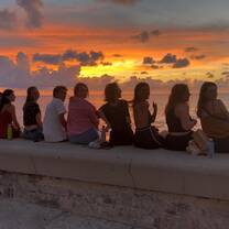 Enjoying sunsets at the Malecon with friends (from the hostal)