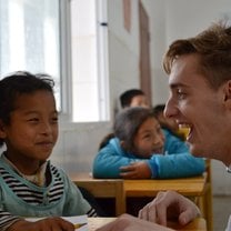 Teaching English to a group of happy students