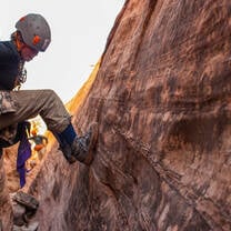Male gap year participant canyoneering with Outward Bound.