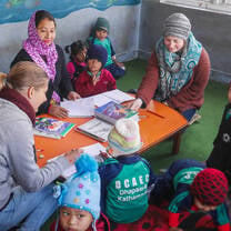 Teach eager to learn children in Nepal