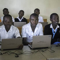 Students with computers supported by SACOLA.