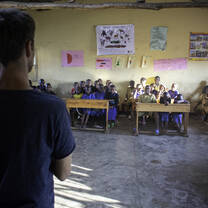 Volunteer teaching nature & animal conservation in Rawanda.