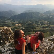 Views and friends. This is my friend and I, on top of a huge rock in the middle of Italy! Pietra di Bismantova, located in Reggio Emilia. We we're so lucky we we're able to climb the mountain and see amazing views like this one!