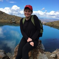 Me walking across a bridge during a hike in the Tararua range.