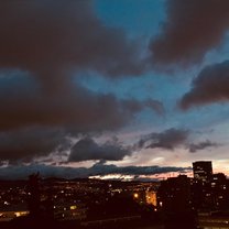 the sun setting over the city