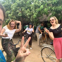 Volunteers selfie riding a bike