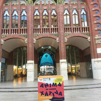The Colon Market in Valencia, a masterpiece and a market place, with the poster in front motivating supporters to go and cheers up for the runners in the upcoming half marathon of Valencia in the end of October 2019