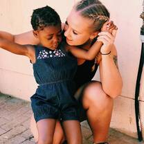 A volunteer and a Namibian child in one of our local programs.