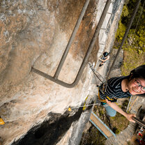 Via Ferrata in Yangshuo with Omeida Chinese Academy A girl climbs via ferrata