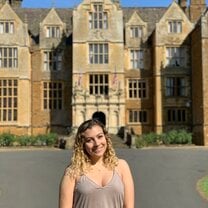 Me standing outside of the abbey on a sunny day
