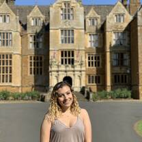 Me standing outside of the abbey on a sunny day