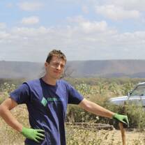 Volunteer planting trees in wildlife buffer zone near Lake Manyara