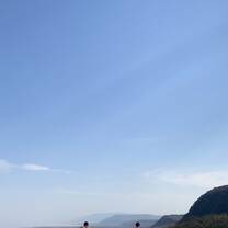 Volunteers relaxing by the infinity pool looking over Lake Manyara