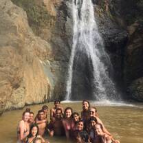 A beautiful hike lead us to a waterfall where some locals were cliff flipping into shallow waters. They got into our photo before finishing some jumps.