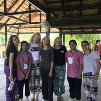 We organized activities and played games to help Thai students with their English exchange program. 