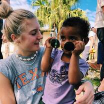 We were doing service one morning laying cement for new pathways in the village and this shy little girl came up and sat with us. Here she is looking very stylish in my sunglasses :))
