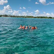 Lacey, Halle, Prutha and I in the warm waters on Bayahibe taking a break from our surveying, using benthos squares, of the coral!!