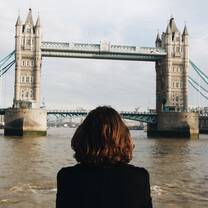 Woman looking at Tower Bridge